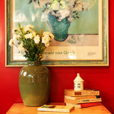 Yellow Marigold Aura metal vase placed on a wooden table with fresh flowers — stylish home décor accent