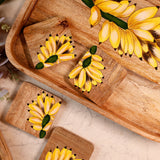 Yellow Marigold Handpainted Coasters Banana Bunch – vibrant mango wood coasters with handpainted banana bunch design for stylish tabletops.