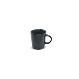 A small, blue porcelain espresso cup with a handle, against a white background.