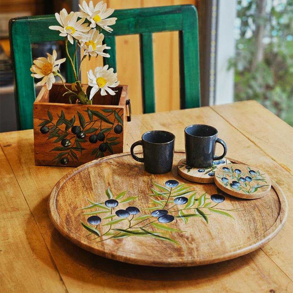 Hero view of Yellow Marigold Handpainted Lazy Susan – Black Olives, artisan mango wood turntable tray featuring hand-painted olive branches and leaves.