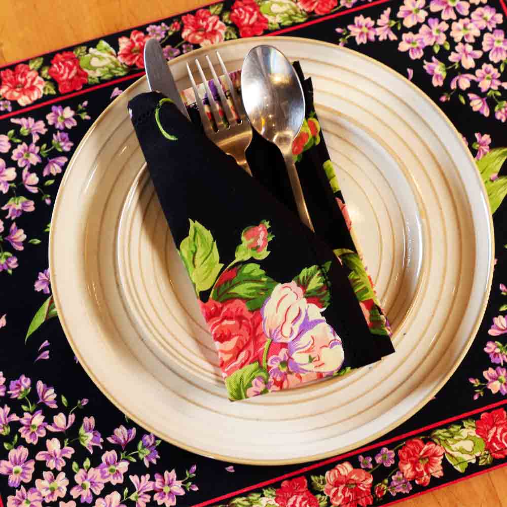 Yellow Marigold Blanche Black Floral Napkins set of 6 — black floral-print cotton napkins neatly folded