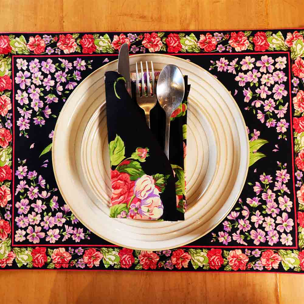 ellow Marigold Blanche Black Floral placemat — close-up view showing handcrafted black floral fabric texture and stitching detail