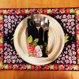 ellow Marigold Blanche Black Floral placemat — close-up view showing handcrafted black floral fabric texture and stitching detail