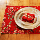Yellow Marigold Milene Red placemats (set of 6) on a wooden dining table with crockery and décor — vibrant home dining setup
