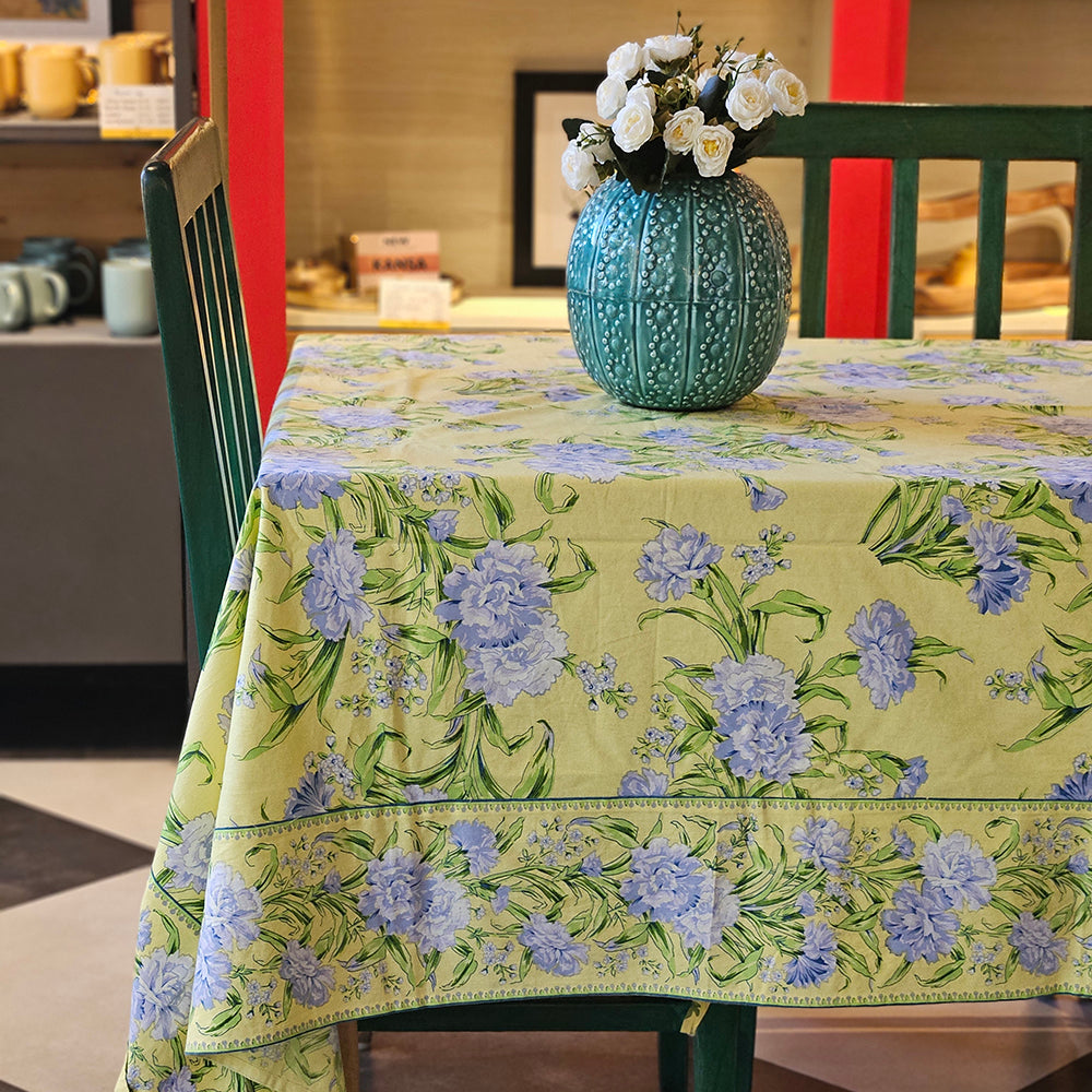 Close-up of Yellow Marigold Sacha Yellow table cover showing artisan cotton weave, mitered corners and French-seam detailing for handcrafted quality