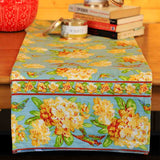 Yellow Marigold Valley of Flowers Mist table runner — floral-print table runner laid flat on dining table