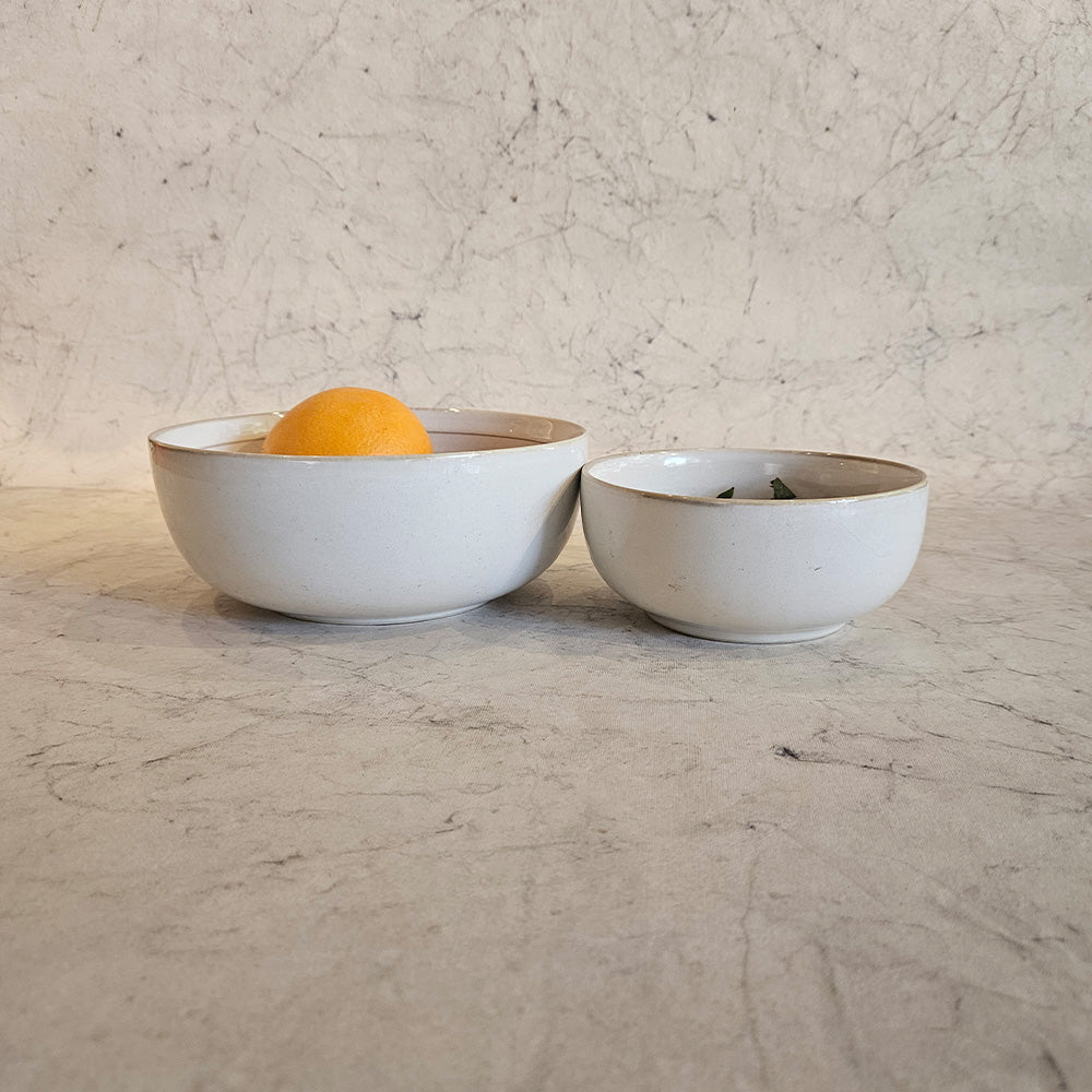 Yellow Marigold Serving Bowl – Cotton White Vintage Paris, featured in a cozy dining setup with handcrafted serveware accents.