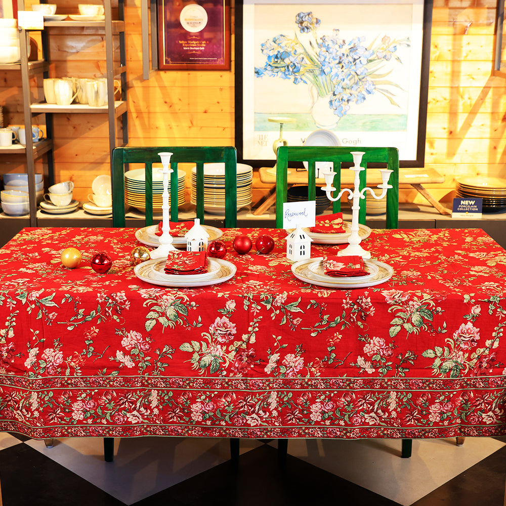 Yellow Marigold Milene Red tablecloth draped over a wooden dining table with crockery and décor — vibrant home dining ambience