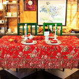 Yellow Marigold Milene Red tablecloth draped over a wooden dining table with crockery and décor — vibrant home dining ambience