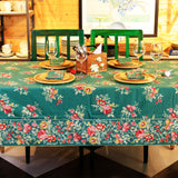 Yellow Marigold Russian Chintz Green table cover draped over a wooden dining table with crockery and décor — cozy home dining ambience