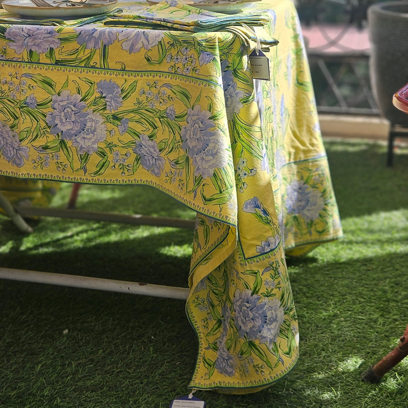 Yellow Marigold Sacha Yellow 100% cotton table cover in sun-yellow floral print, elegant full-length drape for 4- or 6-seater dining table.