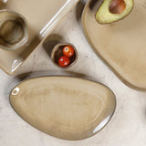 Yellow Marigold Warp Triangle Platter Moon White – handcrafted porcelain in organic asymmetrical triangle shape for stylish serving.